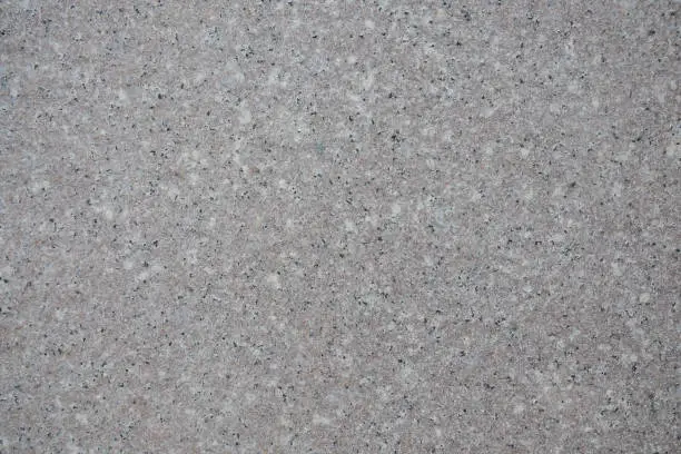 Photo of Gray mottled granite floor texture