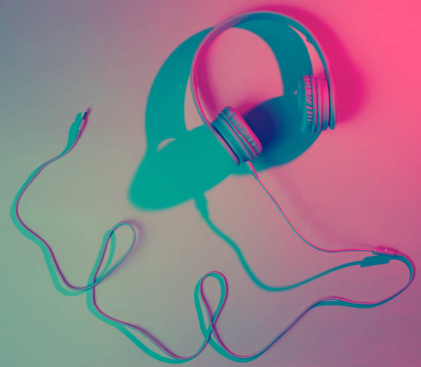 istock Headphones with cable. Retro wave, blue red neon light, ultraviolet. Top view, minimalism 1199572378