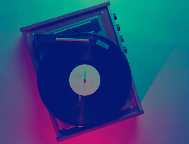 istock Vinyl player with lp record. Retro wave, red blue neon light, ultraviolet. Top view, minimalism 1199573775
