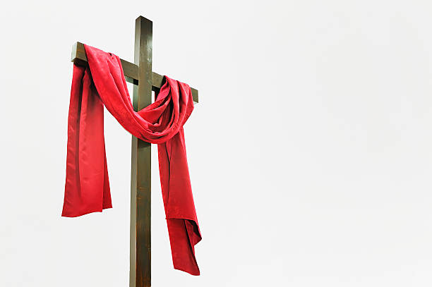 Wooden Cross with Red Cloth Wooden Cross with Red Cloth crucifix photos stock pictures, royalty-free photos & images