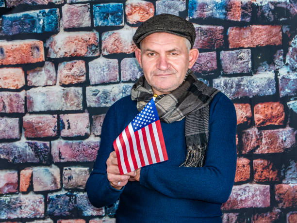 istock A man with an American flag in his hand on Independence Day. 1199579380