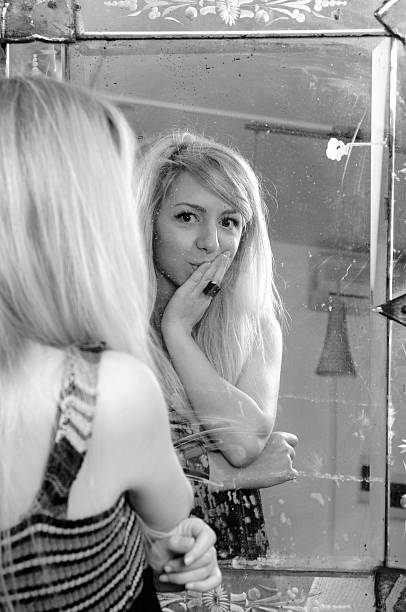 istock woman analyzing her beauty 119958213