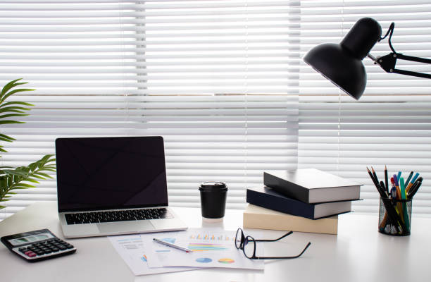 istock Modern office desk near the window with copy space. 1199584014