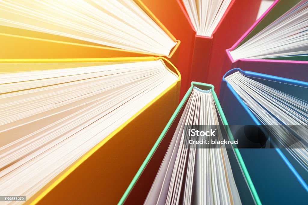 Fanned Out Colorful Books Forming Abstract Circle Pattern - Explosion of Knowledge Fanned Out Colorful Books Forming Abstract Circle Pattern - Explosion of Knowledge. Book Stock Photo
