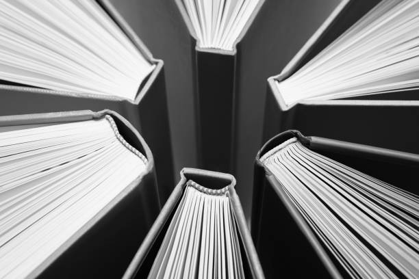 istock Fanned Out Books Forming Abstract Circle Pattern in Black and White 1199586337