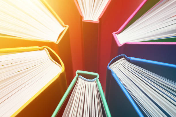 istock Fanned Out Colorful Books Forming Abstract Circle Pattern - Explosion of Knowledge 1199586343