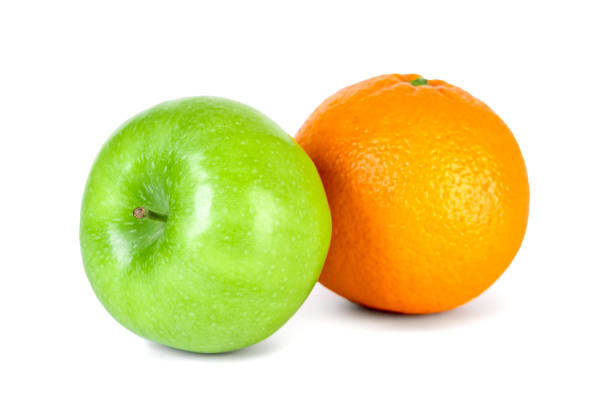 istock Green apple and orange isolated on white background 1199587207
