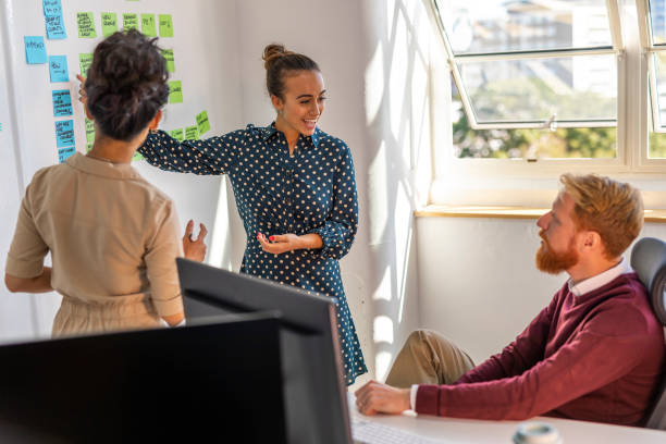 istock Small Business Entrepreneurs Brainstorming in an Open Plan Office 1199587216