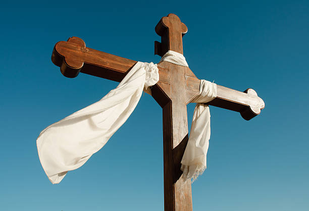 istock white cloth draped over a wooden cross 119958963