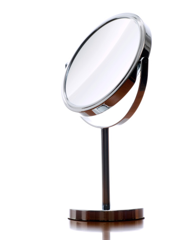Round table mirror on a white background.