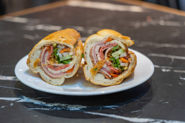 Plate of Vietnamese pork bacon sandwich- Banh Mi