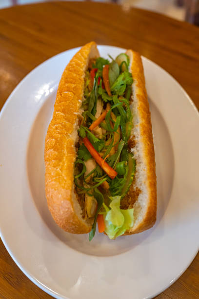 Vietnamese delicious chicken sandwich on white plate - Banh Mi