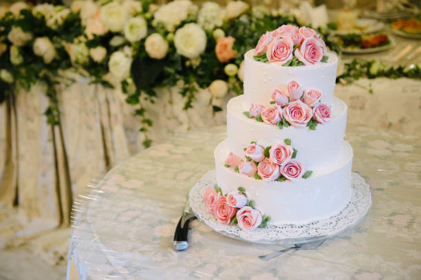 istock Big white wedding cake with fruit is on the table 1199601533