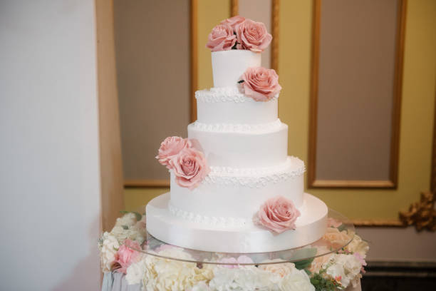 istock Big white wedding cake with fruit is on the table 1199601541