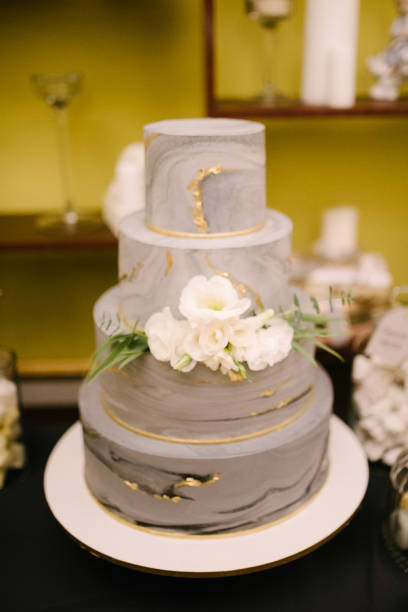 istock Big white wedding cake with fruit is on the table 1199601585