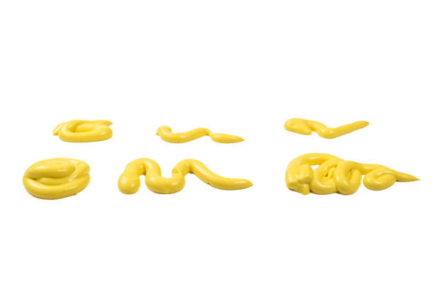 istock Yellow cheese sauce splashes isolated on white background 1199602030
