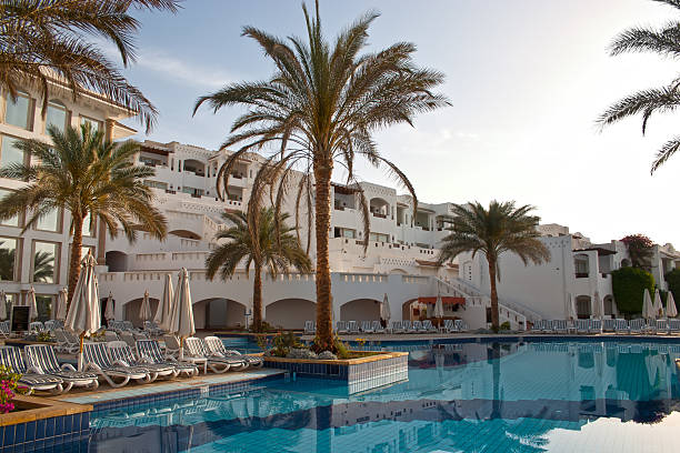 istock swimming pool in tropical hotel 119960356