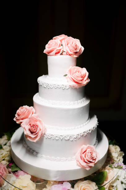 istock Big white wedding cake with fruit is on the table 1199604264