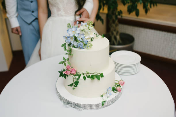 istock Big white wedding cake with fruit is on the table 1199604292
