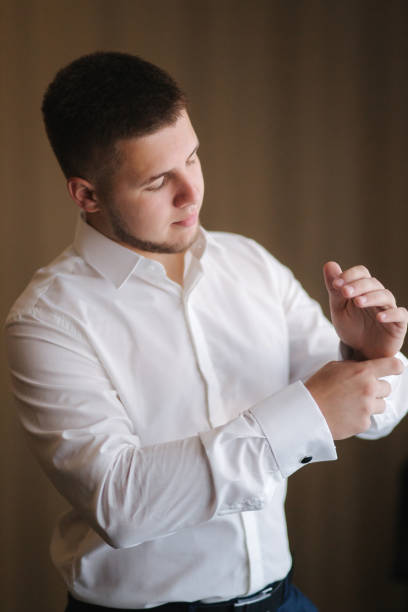 istock Handsome young groom dressed at hotel. Morning in hotel 1199606001
