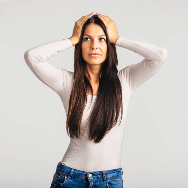 istock Worried young female in studio 1199608843