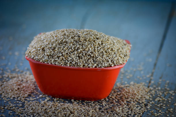 istock Sesame seeds in bowl on wooden background 1199610581