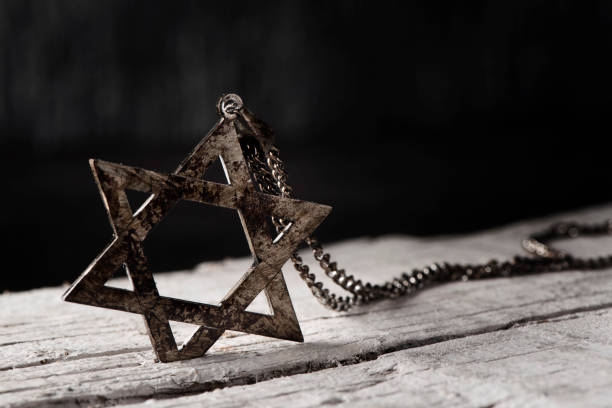 the star of david on a rustic wooden surface stock photo