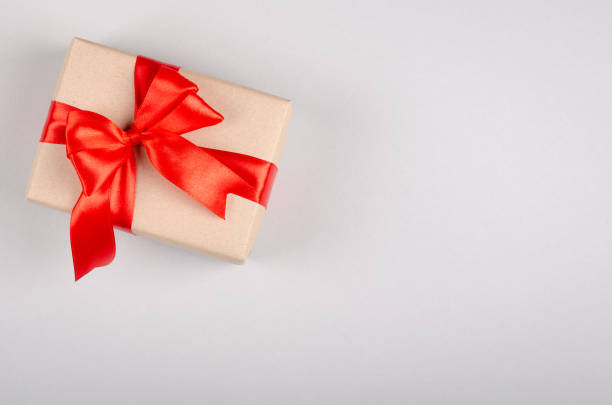 istock Gift box on gray background composition, present with ribbon and bow. 1199611688