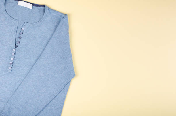 istock Textile, shirt composition on color background. Flat lay. 1199612791