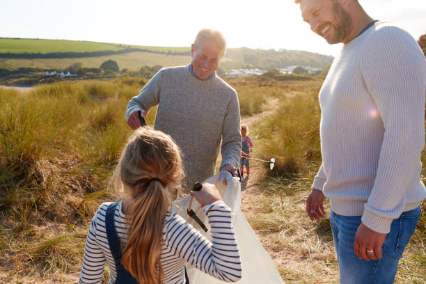 istock Multi-Generation Family Collecting Litter On Winter Beach Clean Up 1199617632