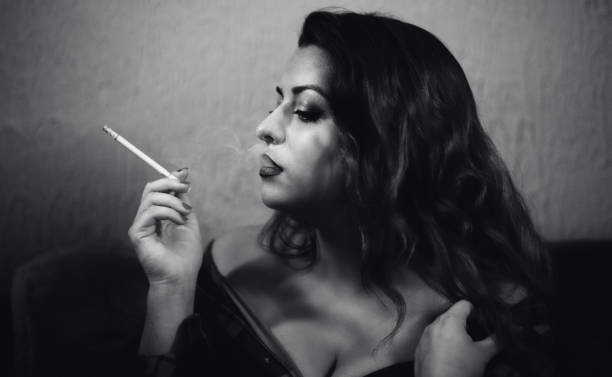 istock Sensual woman smoking 1199619740