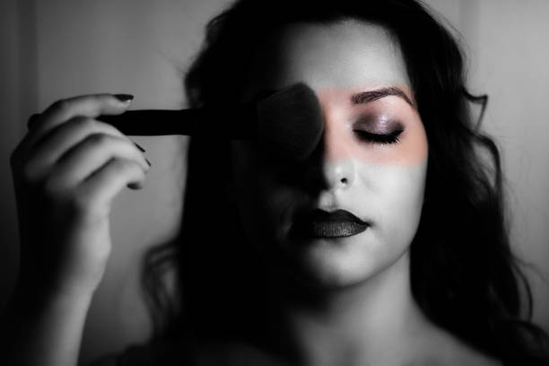 istock Young seductive woman with make up brush 1199619792