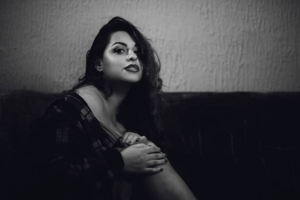 istock Beautiful sensual woman on sofa 1199619841