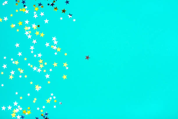 istock Golden and silver stars on mint background. 1199620500
