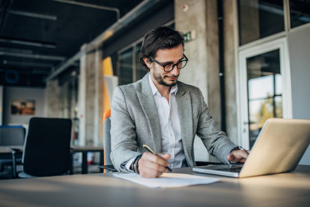 istock Businessman working in the office 1199621054