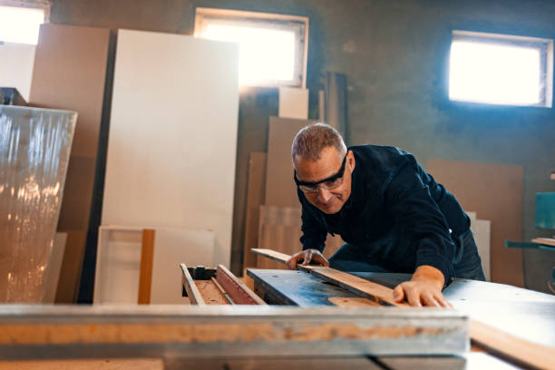 istock Mature Male carpenter working on a project in his workshop 1199621384