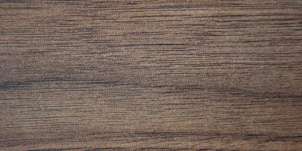 Natural oak wood stained with stain and artificially aged close-up. Background.