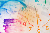 double exposure of coins and clock with calendar for business and finance background