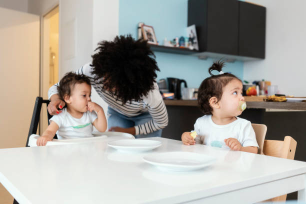 istock Mom and babies at home 1199625124