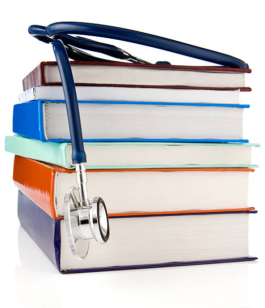 istock books and stethoscope isolated on white background 119962791