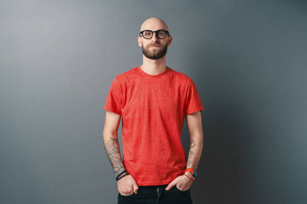 istock Stylish young man posing in the studio on gray background 1199628399