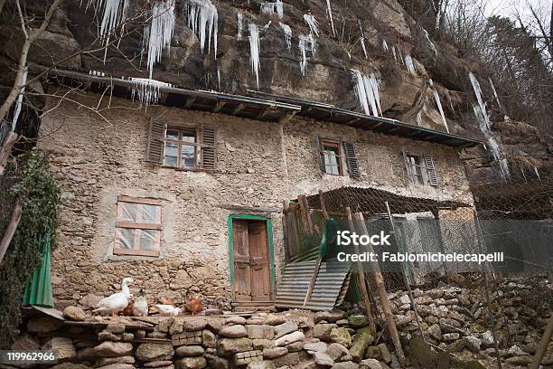 Icicles On A Old House Stock Photo - Download Image Now - Below, Bergamo, Boulder - Rock
