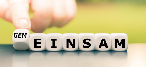 istock Hand turns a dice and changes the German word 