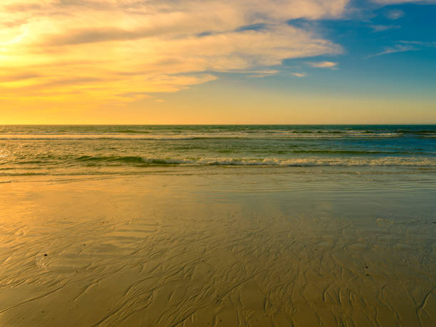 istock Seascape of golden colored beach before sunset on Cape Cod 1199630747