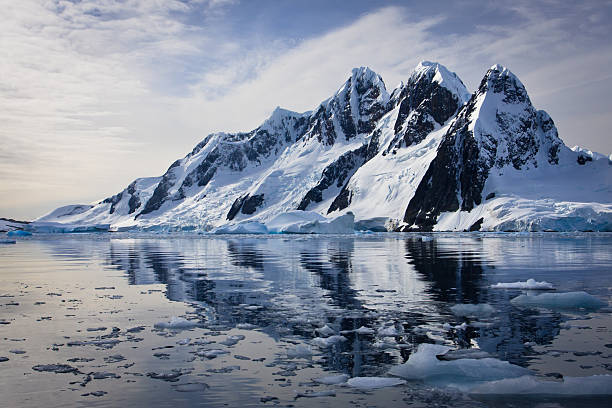 istock Snow capped mountains reflected in water 119963125