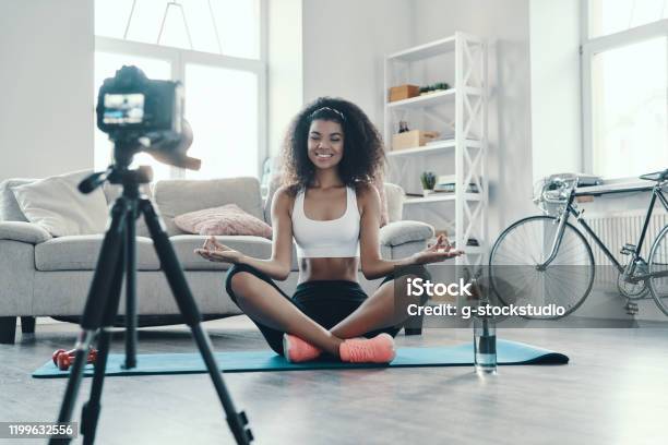 Attractive Young African Woman Stock Photo - Download Image Now - Influencer, Yoga, Exercising