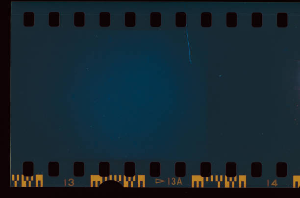 Blue colored Film Light leak Abstract film strip texture background, made with film camera, expired film and scanned to jpg navy blue photos stock pictures, royalty-free photos & images