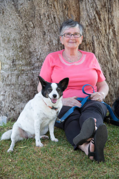 istock Woman In 70s With Dog 1199633138