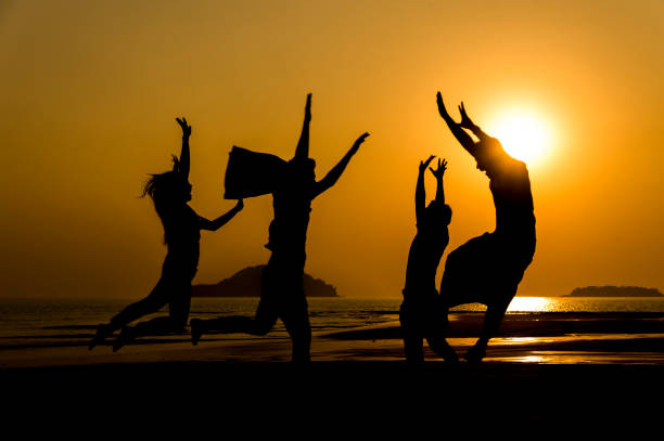 istock Silhouette People Enjoying At Beach Against Sky During Sunset 1199635562