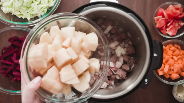 istock Cooking beet soup, borscht with organic vegetables in multicooker. 1199636765